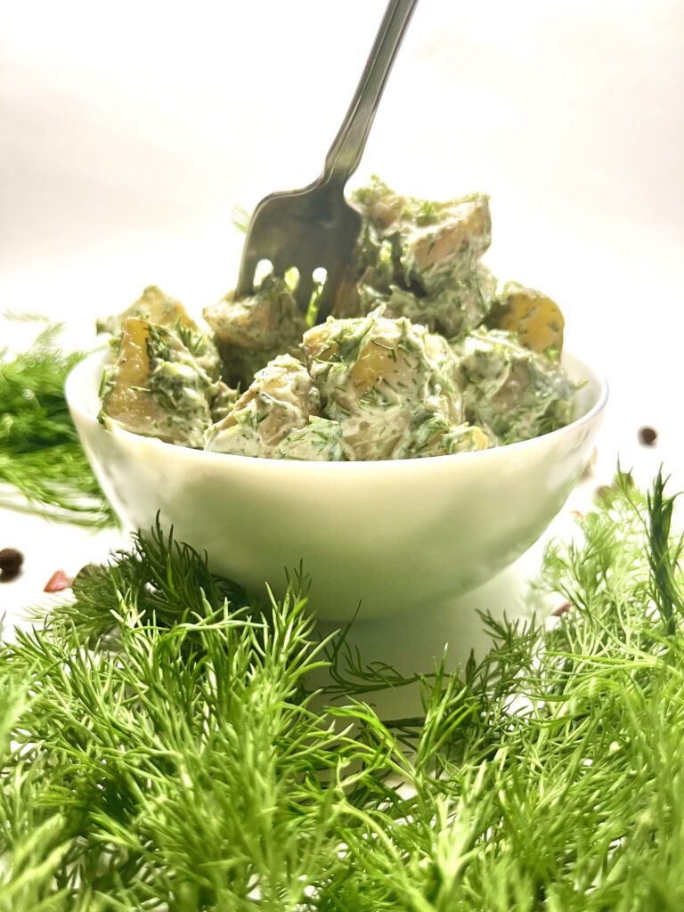 potato salad in bowl with fork