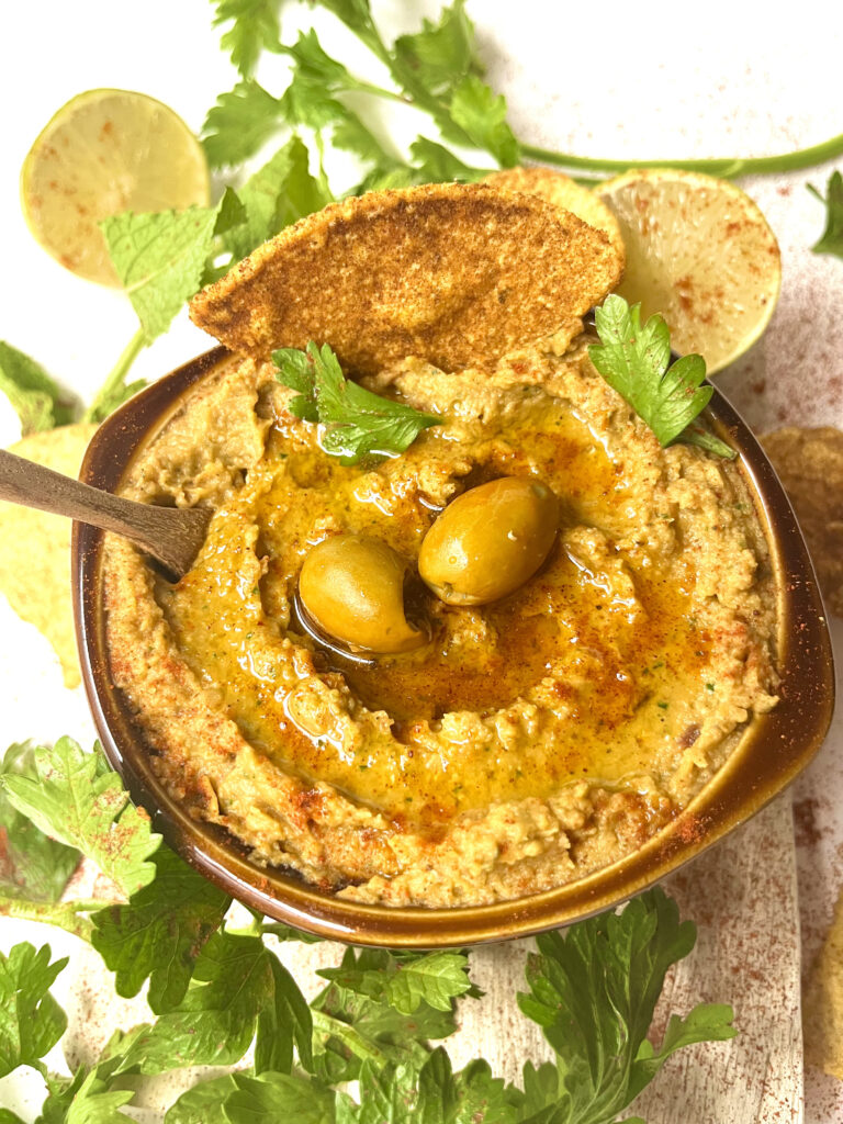 hummus with olives in bowl