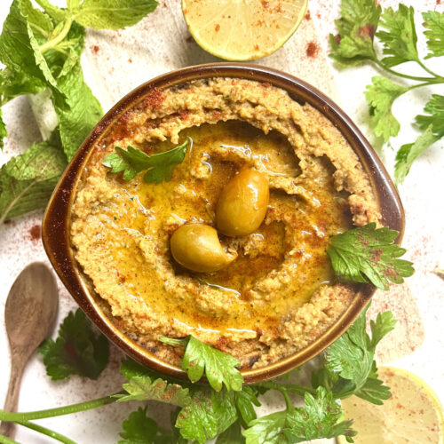 hummus with olives in bowl