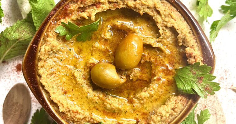 hummus with olives in bowl