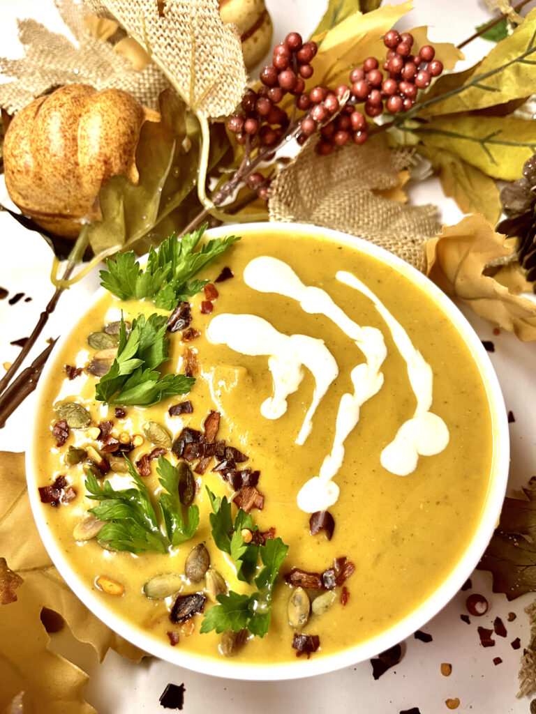 roasted pumpkin soup in bowl with decorations