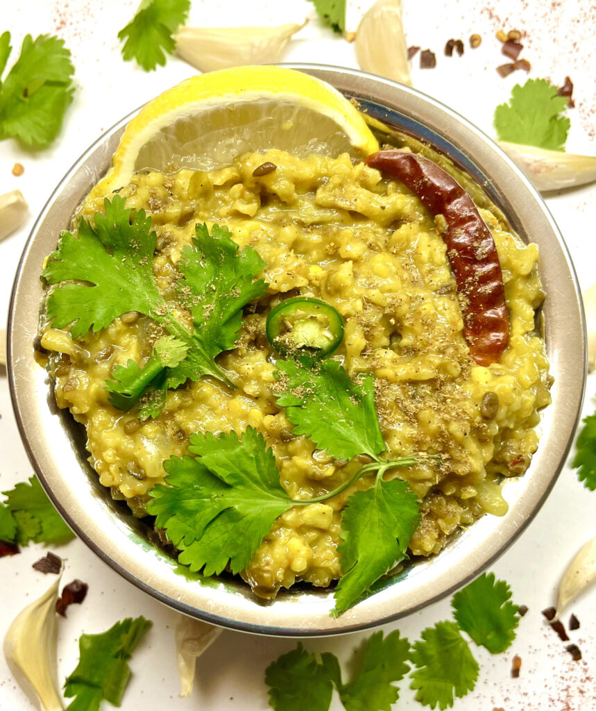 khichdi with garnishes on plate