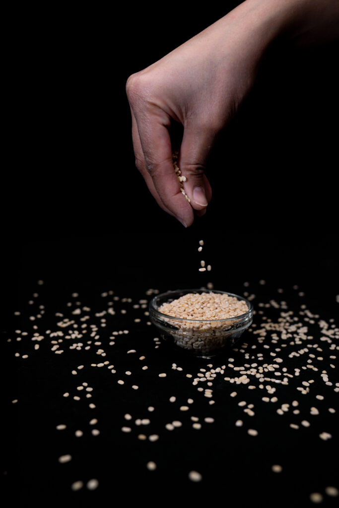 urad daal in bowl with hand