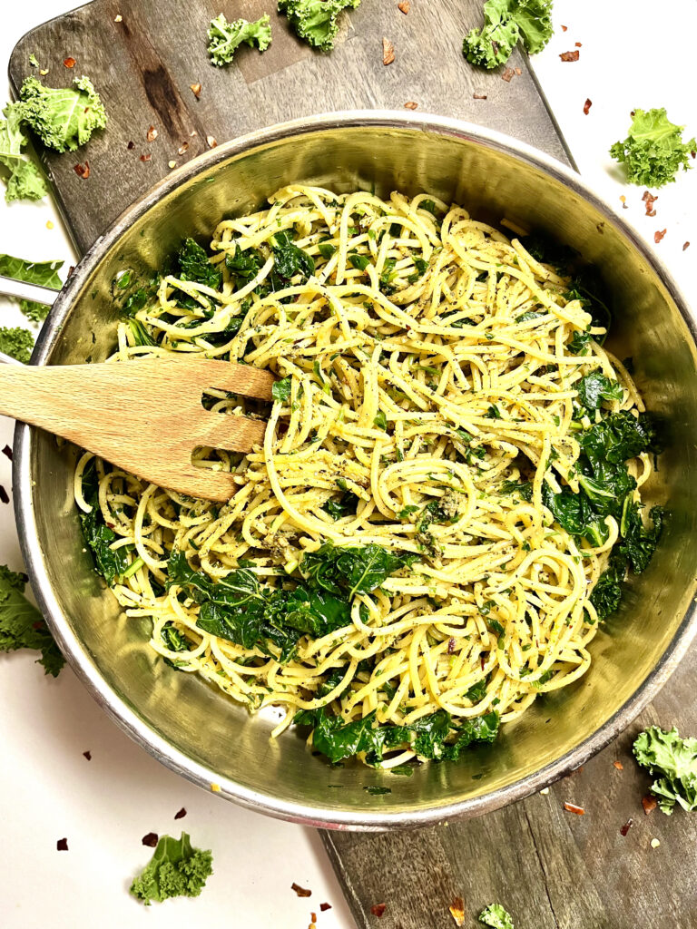 garlic herbed spaghetti with mixing fork