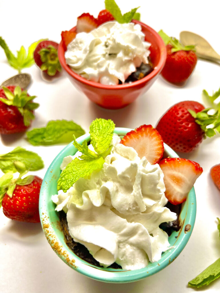 chocolate pudding in small cups with whipped cream