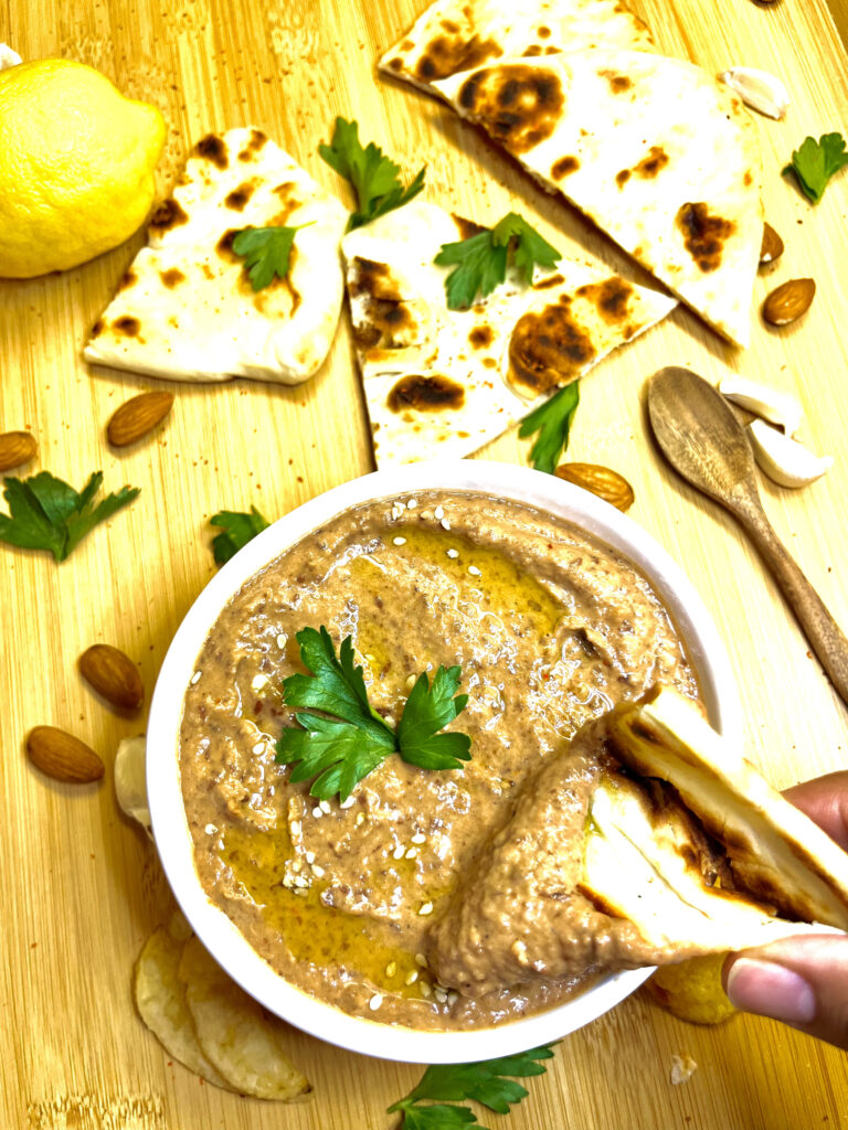 hummus in bowl with pita
