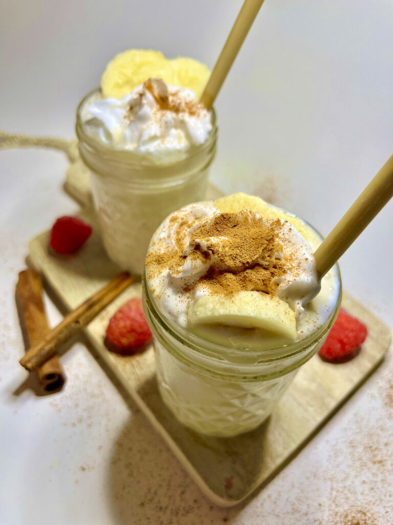 smoothie in jars with cinnamon and whipped cream