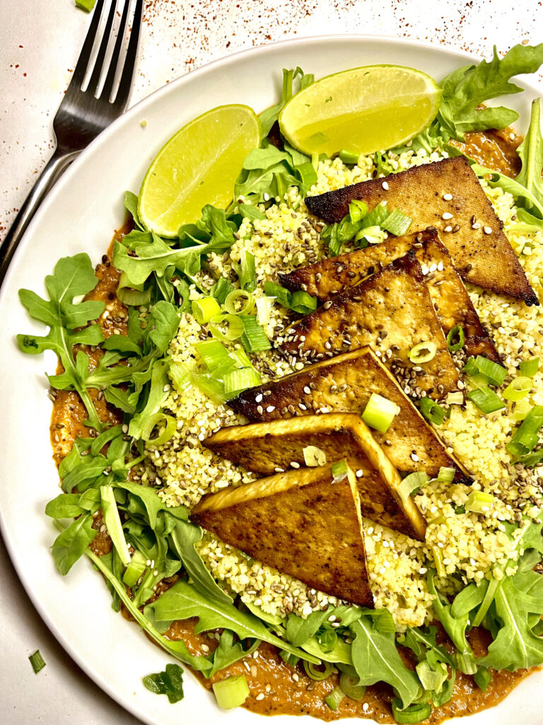 tofu steaks on bed of garlic couscous