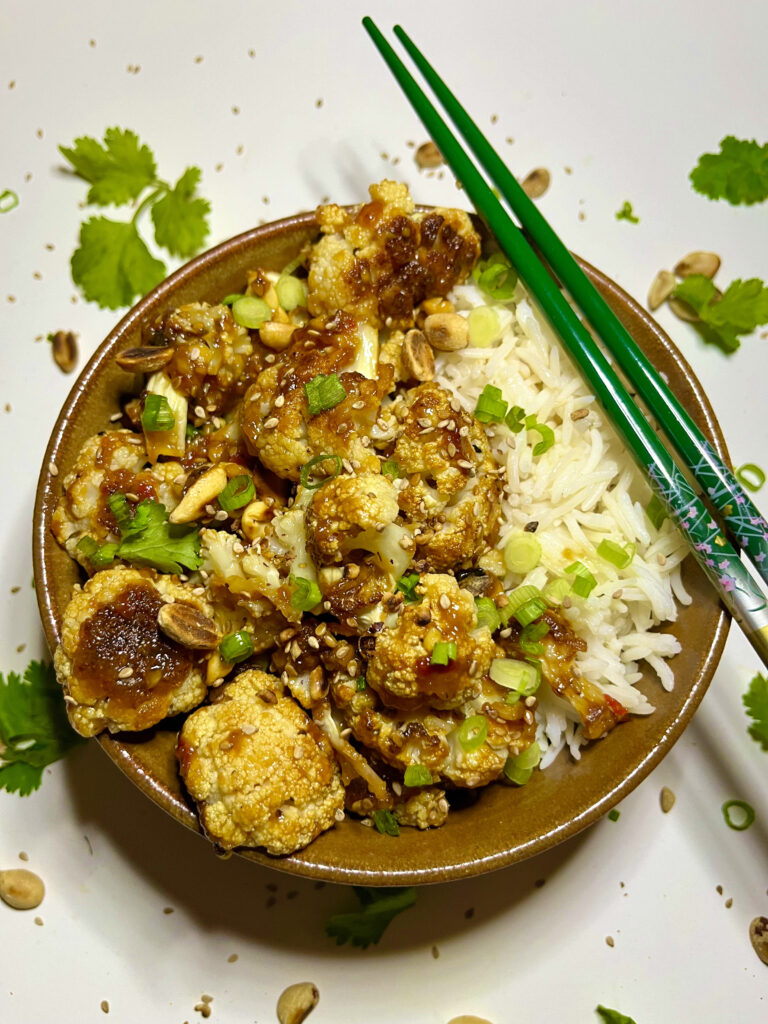 kung pao cauliflower with rice on plate