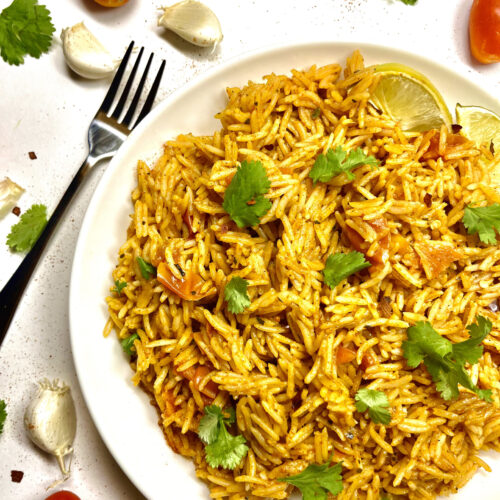 spanish rice on plate with fork