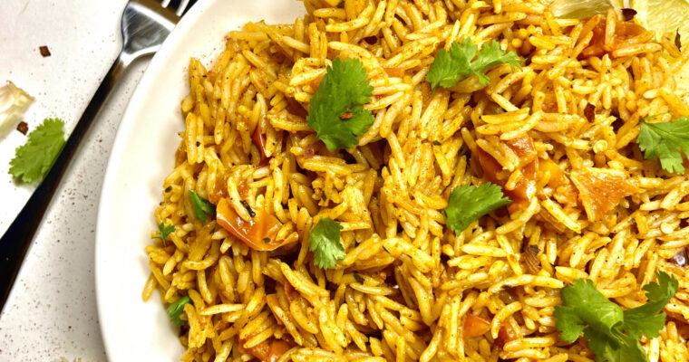 spanish rice on plate with fork