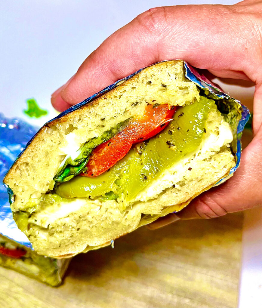 roasted veggie sandwich in hand