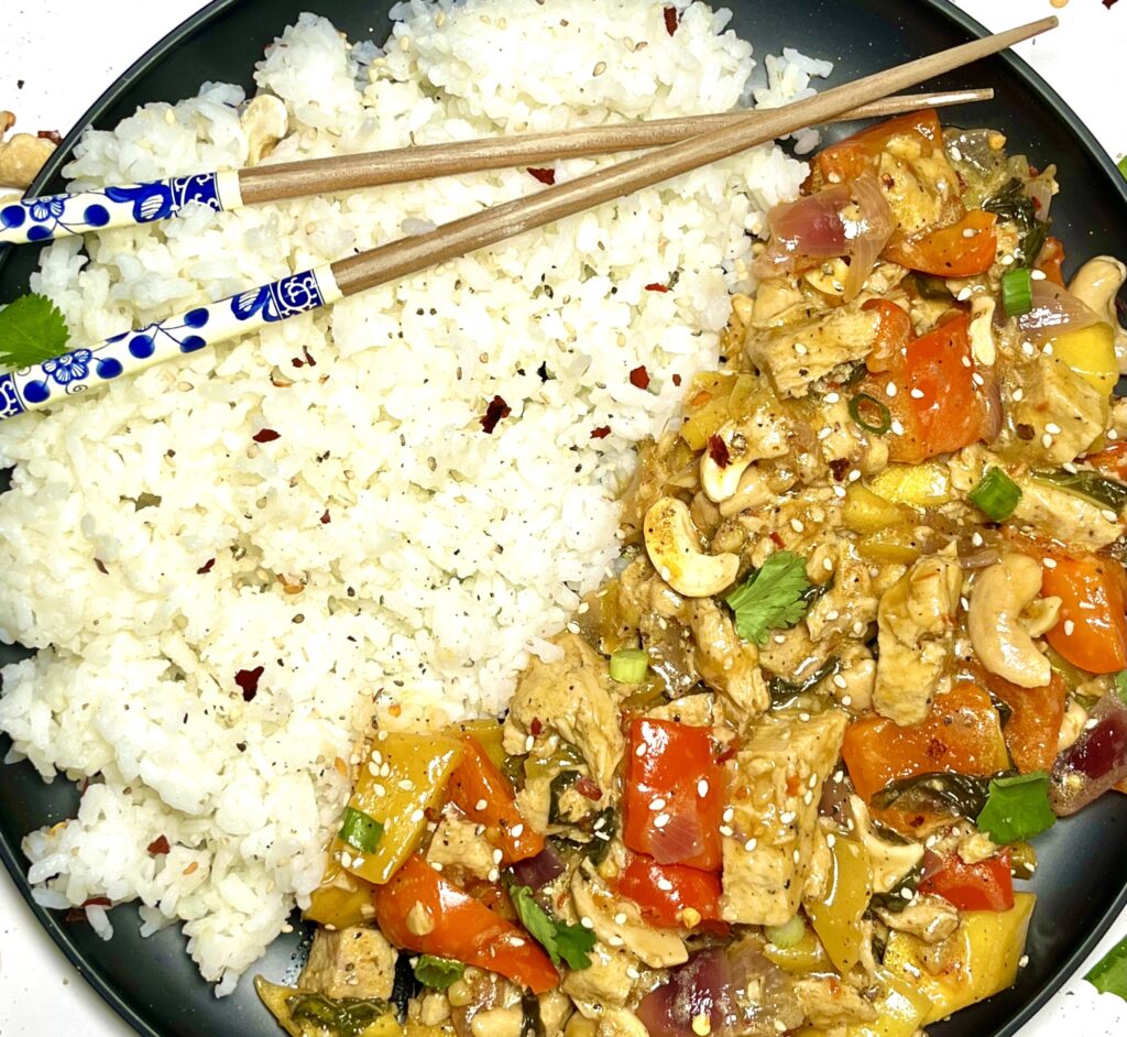 thai mango basil chick'n with rice and chopsticks