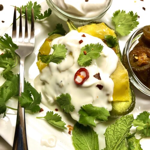 stuffed peppers with fork and garnishes