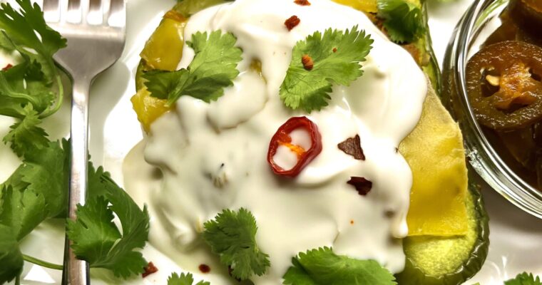 stuffed peppers with fork and garnishes